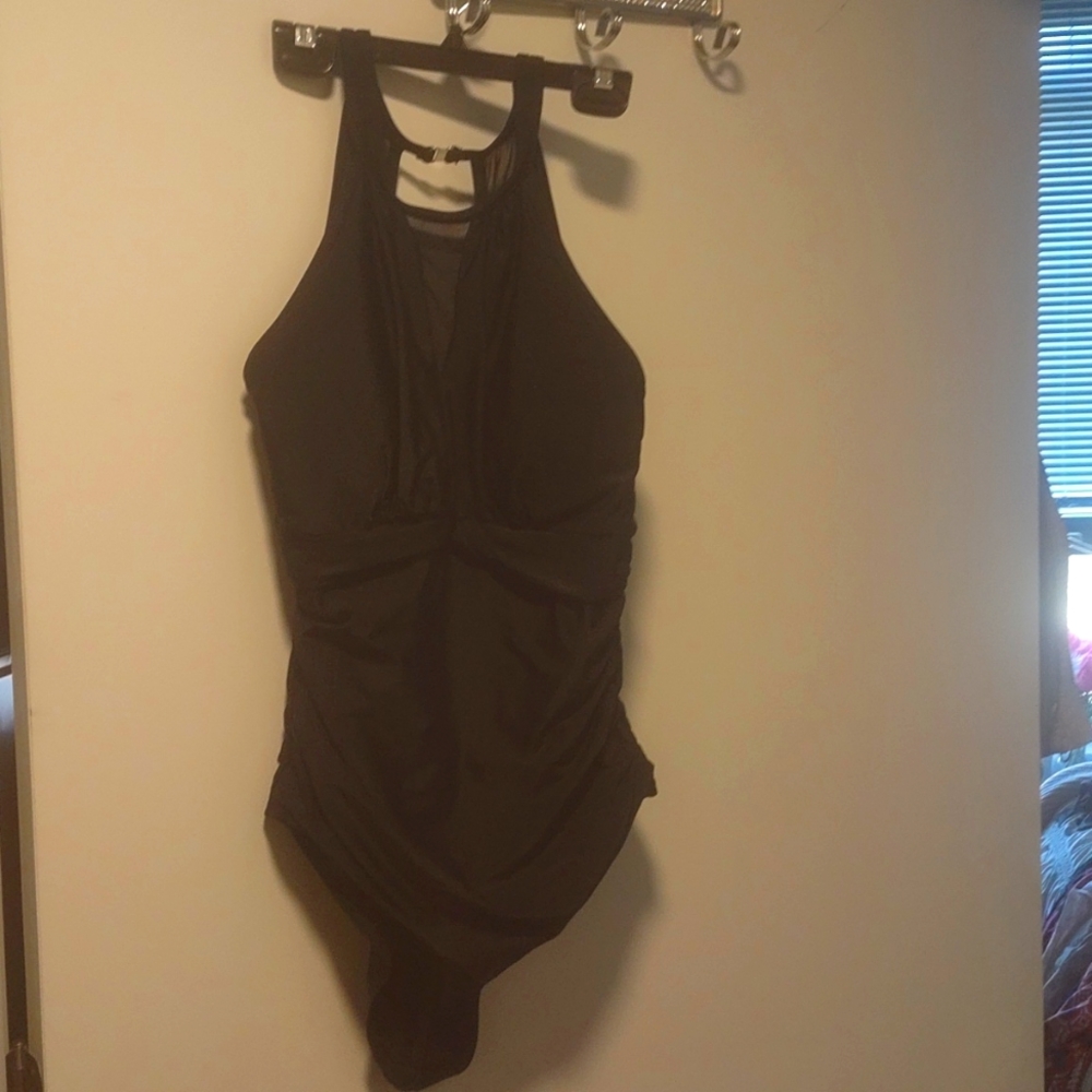 Swim suit by Tempt me.